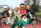 Pictured on board an open top bus at the start of the St Patrick's Day parade at University Road were, back from left: Mike Cummins, Galway RNLI, Mary Bennett, Grand Marshal, Galway RNLI's Stormy Stan and Mike Swan, Grand Marshal. In front are John Farrell as St Patrick, Galway Town Crier Liam Silke and Caitriona Swan, Galway RNLI.