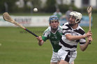 Sarsfields, Noel Kelly,<br />
and<br />
Turloughmore's, Daithi Burke,<br />
during the Senior Hurling Championship at Athenry.