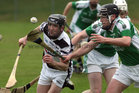 Sarsfields, Joseph Burke,<br />
and<br />
Turloughmore's, Brian Murphy,<br />
during the Senior Hurling Championship at Athenry.