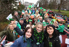 Musician Sharon Shannon  (front, centre) who was grand marshal for the Galway City St Patrick's Day parade, with friends and guests on board an open top double decker bus which led the parade.<br />
