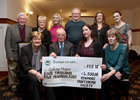 Renmore Pantomime Society presented €4,500 to Galway Hospice at the society's dinner at the Menlo Park Hotel. The contribution was the proceeds from the charity fundraiser during their production of Beauty and the Beast at the Town Hall Theatre. Pictured at the presentation at the dinner were, seated from left: Maureen McCarthy, committee, Gerry Molloy of Galway Hospice, and committee members Chontelle Kenny and Anne McElwain. Standing: Committee members Joe McCarthy, Mary Loughnane, Simone Watson, John Benson, Anna Byrne and Emma Murphy.