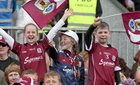 Young supporters cheer on Galway during the Connacht Senior Football final against Roscommon at Dr Hyde Park in Roscommon.