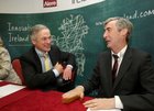The Minister for Jobs, Enterprise and Innovation Richard Bruton, and David Toohey, President of Business Operations with Alere, during the new jobs announcement by Global healthcare company Alere at the Clayton Hotel last Friday.
