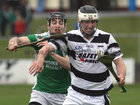 Sarsfields, Eamon Cleary,<br />
and<br />
Turloughmore's, Gary Burke,<br />
during the Senior Hurling Championship at Athenry.