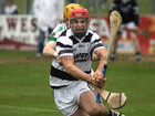 Sarsfields, Ian Skehill,<br />
and<br />
Turloughmore's, Fergal Moore,<br />
during the Senior Hurling Championship at Athenry.