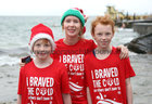 Mary Farragher, Tuam, with her son Charlie and daughter Megan at Blackrock for the COPE Galway Christmas Day swim.