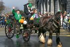 Guest of Honour, Paralympic medalist Shane Curran from Moycullen who is a member of Galway Speeders Club, waves to the crowd during the St Patrick's Day Parade in the city.