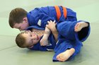 Barry Treacy, Castlegar Judo Club (orange belt) and Sean Thornton, Knocknacarra Judo Club, competing at the Connacht Judo Championships in the Knocknacarra Community Centre.