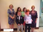 Eithne Donoghue, Duniry, with her grandchildren Gillian, Ruth, Mark and John, all winners of 'Write-a-Book' awards at the Galway Education Centre pictured with their Principal Jacinta Larkin of St Brendan's National School, Duniry, Loughra
