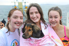 Sisters Elizabeth and Jane Ryan from Barna with their dog Billy Murphy, and their friend Andrea Shaughnessy, also from Barna, after their swim at Blackrock on Christmas Day.