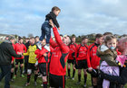 Michael Sullivan celebrates with his son Mark Anthony after Mac Dara, Carraroe, were presented with the Division 3 Cup at Millars Lane in Galway city last weekend.