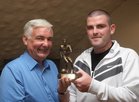 Patsy O'Connor, Club Cairman, presenting the A Team Player of the year award to David Walsh at the West United AFC annual awards presentation night at Monroes.