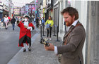 Galway Town Crier Liam Silke out on the city centre streets on Monday welcoming back shoppers and thanking staff and business owners, who have been able to reopen, after the easing of Covid-19 restrictions.