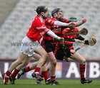 Cappataggle's Michael Broderick gathers possession from Colin Murphy of Blarney.
