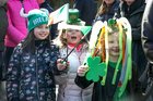 Children at University Road in the city to watch the St Patrick's Day parade.