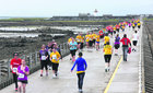 Runners on the Mutton Island causeway during the Galway Simon Womens Mini-Marathon.  23/6/2013