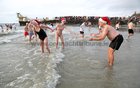 Ronnie Greaney of the Dew Drop Inn with his sister Sheila and his daughter Katie at Blackrock for their Christmas Day Swim.