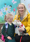 ALL SMILES . . . Aoibhinn Moore, Dalysfort Road, Salthill, with her daughter Emily and their pet Max at Scoil Ide, Ard na Mara, after Emily finished her first day at Scoil.