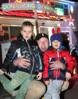 The Carrick Family Light Show has returned as 70,000 lights are illuminated on and around their house at 167 Lurgan Park (H91 Y17D) in aid of Claddagh Watch Patrol. <br />
The Carrick’s next door neighbour Piotr Pankau and his sons Alan and Kuba are pictured at the show.