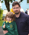 Stephen McDonagh from Highfield Park with his son Stephen after finishing his first day at Scoil Ide, Árd Na Mara, Salthill, 