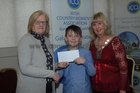 <br />
Mary Creaven-:Ludden Cregal Art presents Ken Keaveney, Clarin National School, with his prize after he won first prize at the ICA Children s Short Story Writing Competition in the Menlo Park Hotel, Also in the picture is Sharon Kelly, President Galway ICA. 