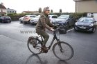 Galway West independent candidate Catherine Connolly arriving on her bicycle on the first day of the count in Galway Lawn Tennis Club on Sunday morning.