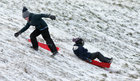 Children having fun in the snow at Salthill Park