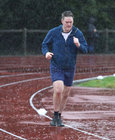 Running the GOAL Mile during the heavy rainfall at the NUI Galway Dangan running track on Christmas Day. 