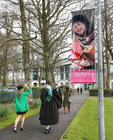 IF THE CAP FITS … NUI Galway graduates make their way to the Bailey Allen Hall to receive their degrees as a banner with an image of Sharon Shannon smiles down at them. Sharon was conferred with an Honorary doctor of Music at the college in 2018.