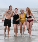 Fionn Moloughney and his sister Ciara and Hannah Kiely, Clarenbridge, and her daughter Medb Kiely-Cuddy, after taking their dip at Blackrock during the COPE Galway Christmas Day Swim.