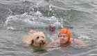 Deirdre Connolly from Newbridge, Ballinasloe, with her Goldendoodle Lilly at Blackrock for their Christmas Day swim.