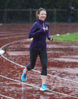Running the GOAL Mile during the heavy rainfall at the NUI Galway Dangan running track on Christmas Day. 