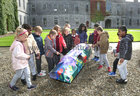 Pupils from Scoil Chroi Iosa examine of the 21 currach sculptures displayed in the Quadrangle at NUI Galway for Culture Night. The exhibition of the painted currachs, commissioned to celebrate 21 years of Árus Éanna, the Inis Óirr Arts Centre on The Aran Islands, was hosted by NUI Galway.