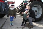 Ken Sweeney and his son Joe (2) from Kilcolgan with Hannagh Loughney (4) at Athenry Mart last Sunday before the start of the East Galway Tractor Run in aid of Hand in Hand, the Children's Cancer Charity. 