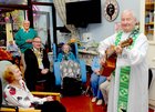 <br />
Very Rev John Hughes, with Cllr Pearce Flannery, Mayor of Galway, resudents and Neighbours from Bowlingreen sing Happy Birthday  to Kitty Kelly, on her 104th Birthday at Unit 5 Merlin Park. 