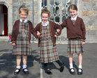 Senior infants Millie, Robyn and Erica wearing Scoil Fhursa’ new uniforms.