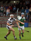 Sarsfields, Noel Kelly,<br />
and<br />
Turloughmore's, Brian Holland,<br />
during the Senior Hurling Championship at Athenry.