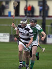 Sarsfields, Eamon Cleary,<br />
and<br />
Turloughmore's, Gary Burke,<br />
during the Senior Hurling Championship at Athenry.