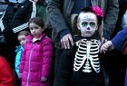 Some of the many young spectators who were among of the thousands of people who lined the city streets to watch the Macnas Halloween Parade 'Danse Macabre' last Sunday evening.