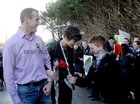 <br />
Damian Coen, presents a rose to Maria Walsh, on her visit to Presention College Headford, with escort Ger Farragher and pupils 