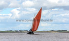 The Galway hooker An Tonai arriving with its cargo of turf Off Parkmore on the first leg for the turf race at the Cruinniu na mBad Festival last weekend.
