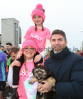 Brittany Heneghan with her husband Paul Heneghan from Turloughmore and their Daughter Macailin, who are living in Boston, before the start of the 2023 Fields of Athenry 10k Road Race, in which Brittany ran, on St Stephen's Day. 