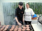 <br />
Alan Traynor and Marie McGourty, cooking at the Medtronic BBQ in aid of Galway Autism Partnership at NUIGalway.  