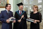 Charlie Byrne, founder and owner of Charlie Byrne’s Bookshop at the Cornstore in Middle Street, who was conferred with the Honorary degree of Masters of Arts at NUI Galway this week, is pictured with Vinny Brown and Carmel McCarthy of the bookshop.