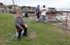 Jimmy O'Connor from Kinvara waiting for the tide to rise for the traditional boat and cimín (seaweed) races at Cruinniu na Mbad Festival at Kinvara Pier at the weekend.
