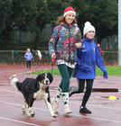 Irene Carroll and her daughter Elodie, Rosscahill, with their pet Scamper taking part in the Goal Mile at Dangan on Christmas Day.