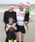 Anna Marie and Jason Craughwell, Renmore, with Daniel (7) and Adam (4) braving the cold during this year's Cope Christmas Day Swim at Blackrock.