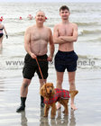 Dermot Coll and his son Owen, Renmore Road, with their dog Harvey at Blackrock for their Christmas Day swim.
