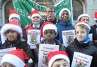 <br />
Mayor of Galway Cllr Neil Mc Nelis singing sing with the choir at the St. Patricks National School Carol Singing on Shop Street. 
