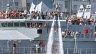 Spectators look out from the LE William Butler Yeats as a flyboarder performs during SeaFes at Galway Docks last weekend.